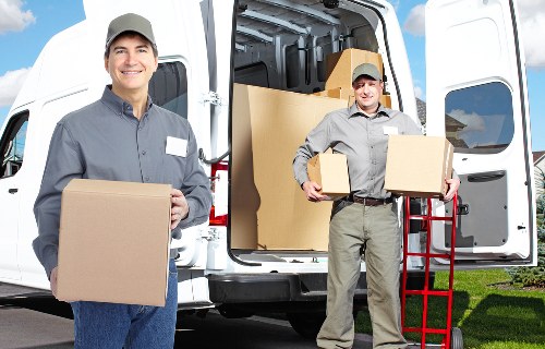 Packed moving boxes and furniture ready for removals in Shirley